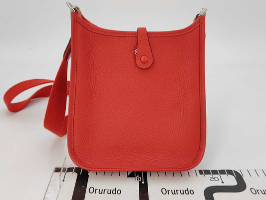 HERMES Evelyn TPMK Stamped Taurillon Leather Shoulder Bag with Silver Hardware and Red Strap