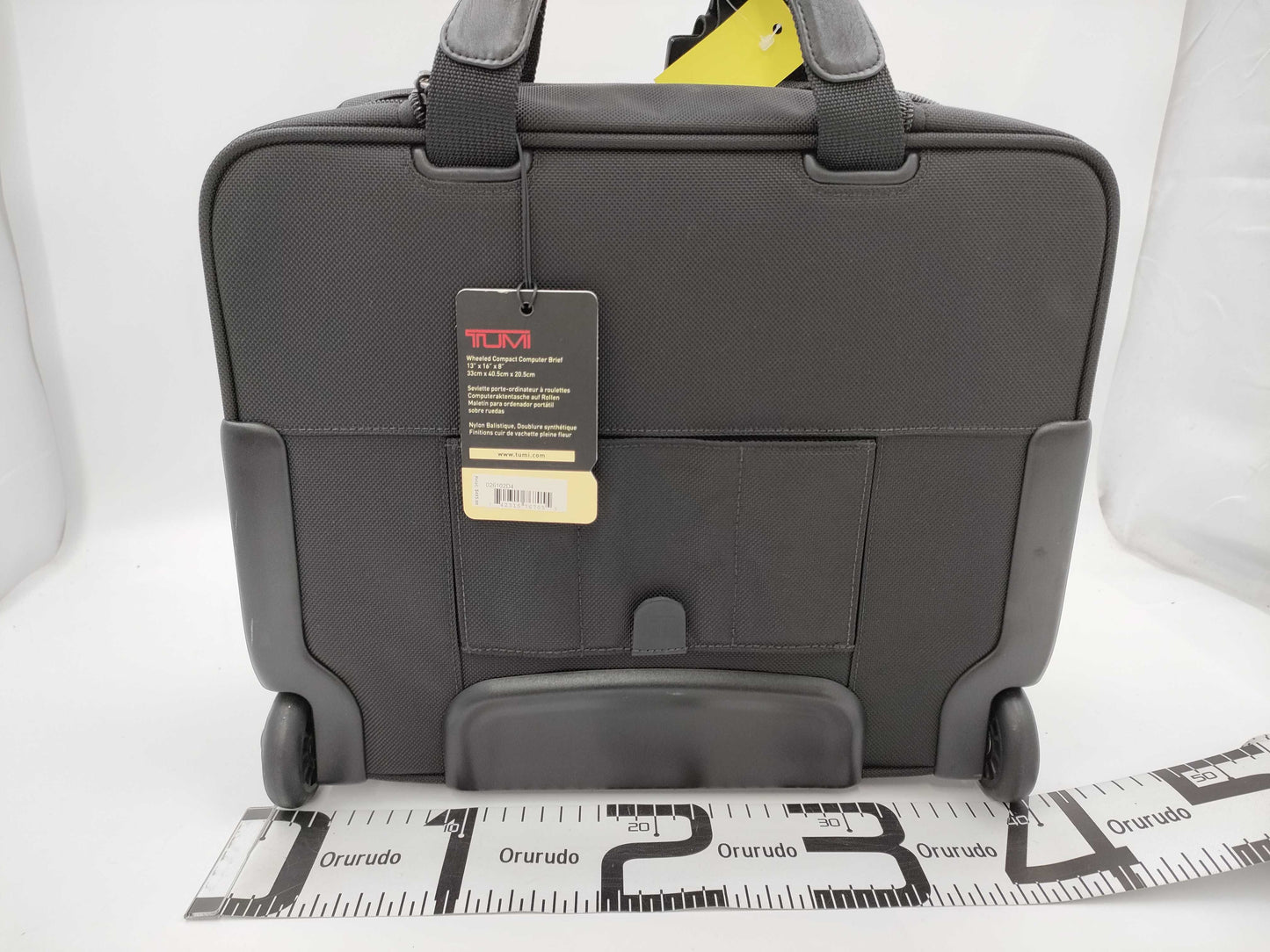 TUMI Boston bag with wheels and tag