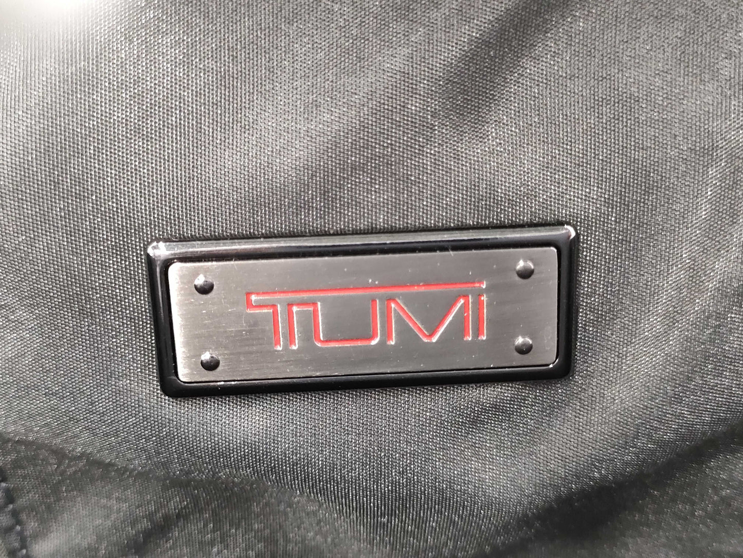 TUMI Boston bag with wheels and tag
