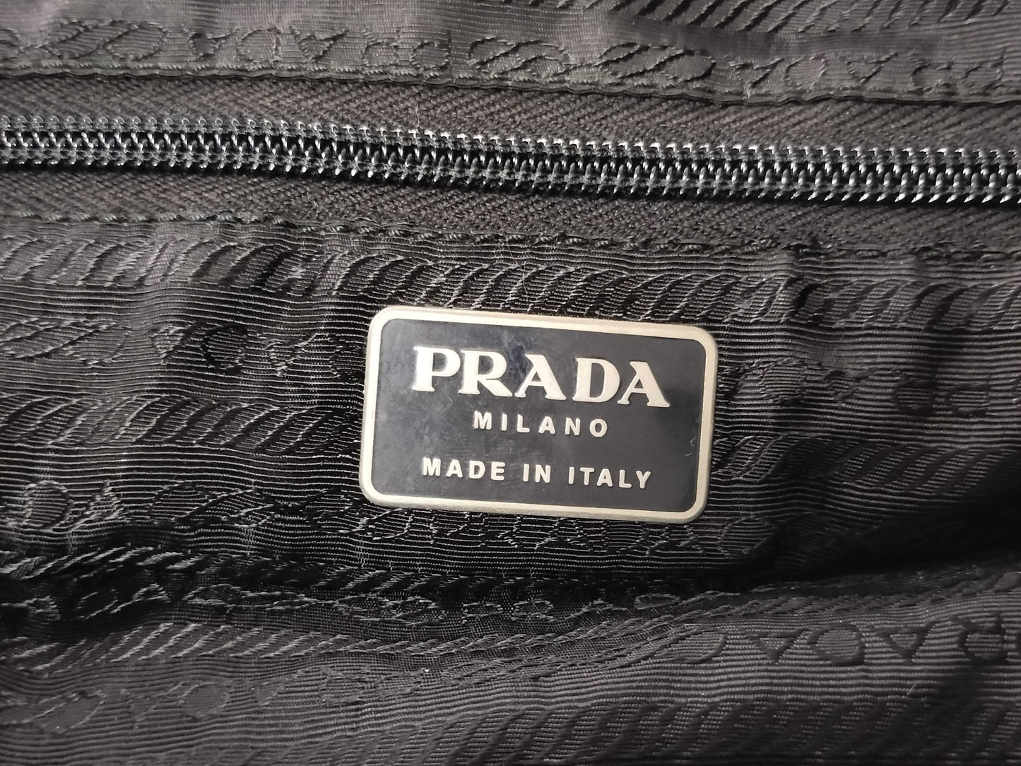 PRADA nylon triangular logo bag, zipper damage, condition considered. Tote bag