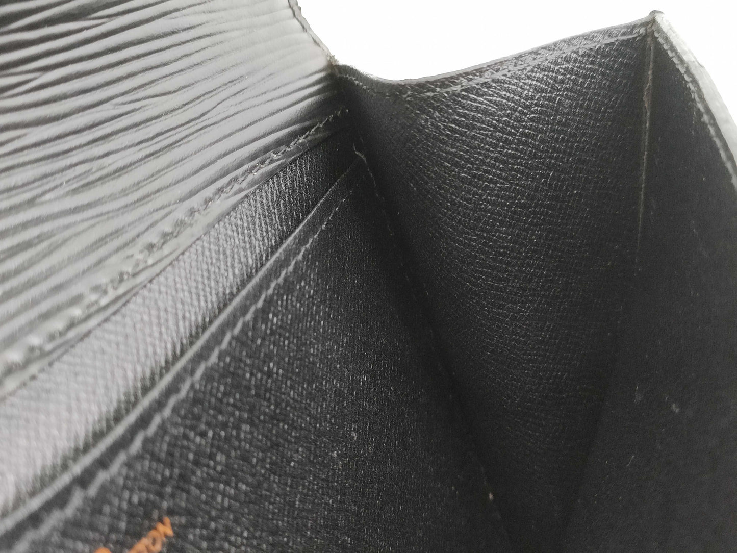 LOUIS VUITTON RFID verification failed. Epi Art Deco clutch bag M52632. Sticky interior.