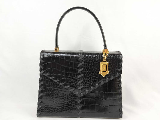 Yves Saint Laurent Embossed Handbag with Charm