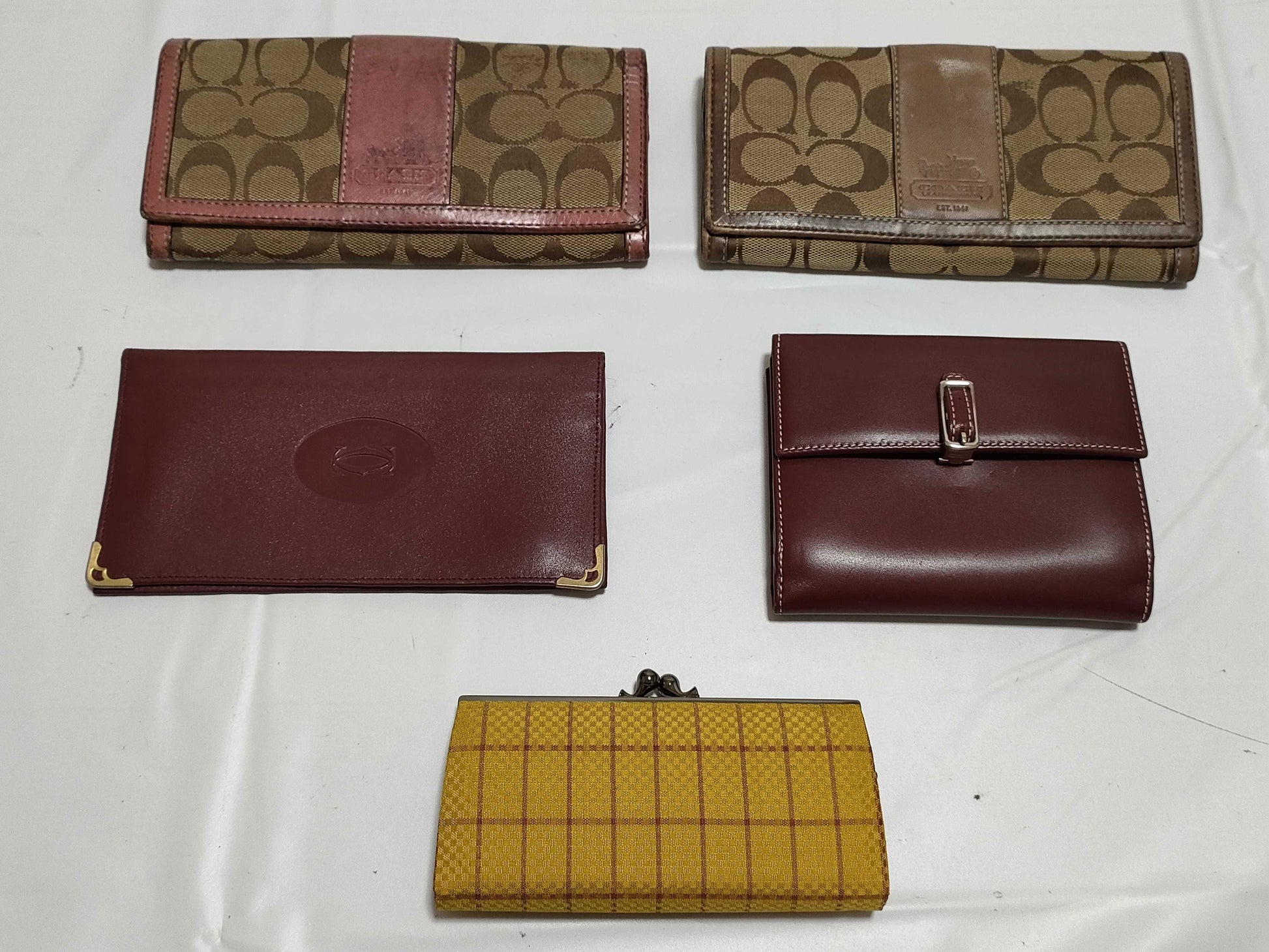 5-piece wallet set including COACH and Cartier