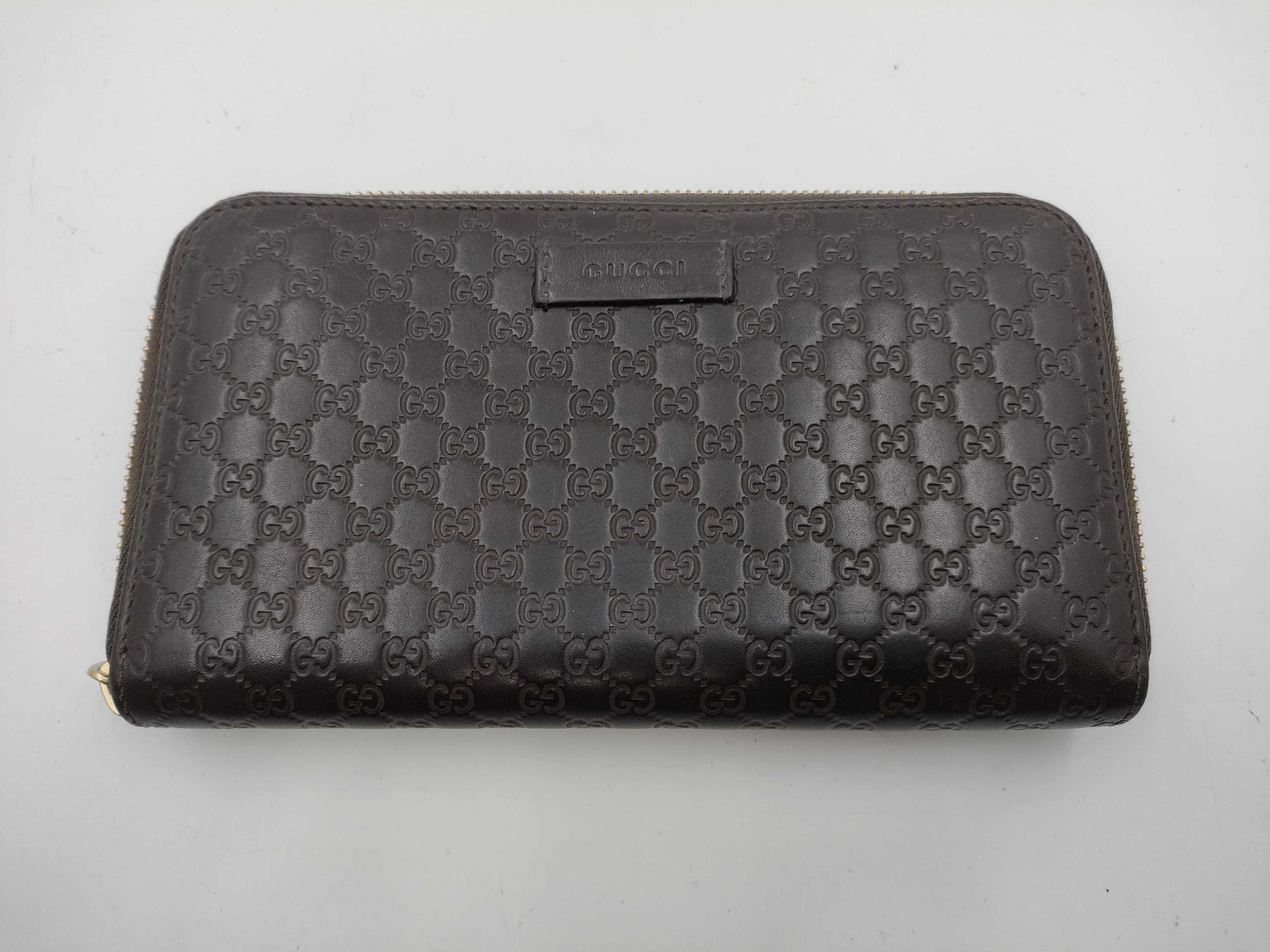 GUCCI Microsima GG Round Zip Wallet in Dark Brown