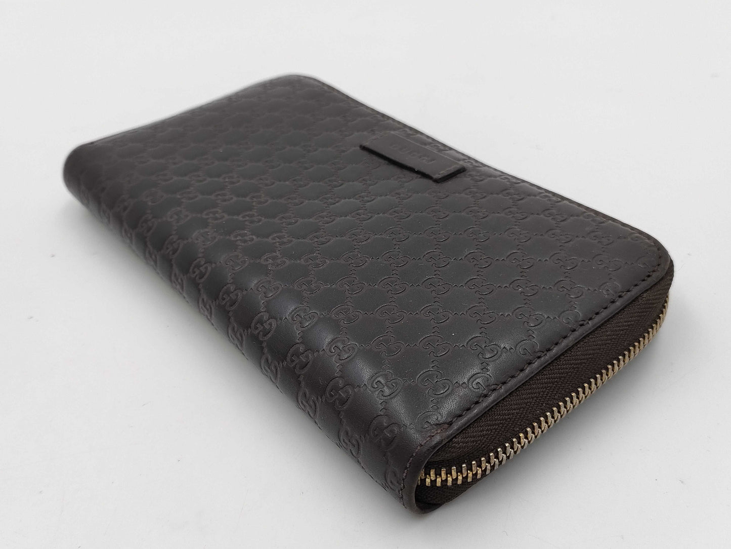 GUCCI Microsima GG Round Zip Wallet in Dark Brown