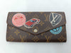 LOUIS VUITTON Monogram World Tour Portefeuille Sarah Wallet with Initials