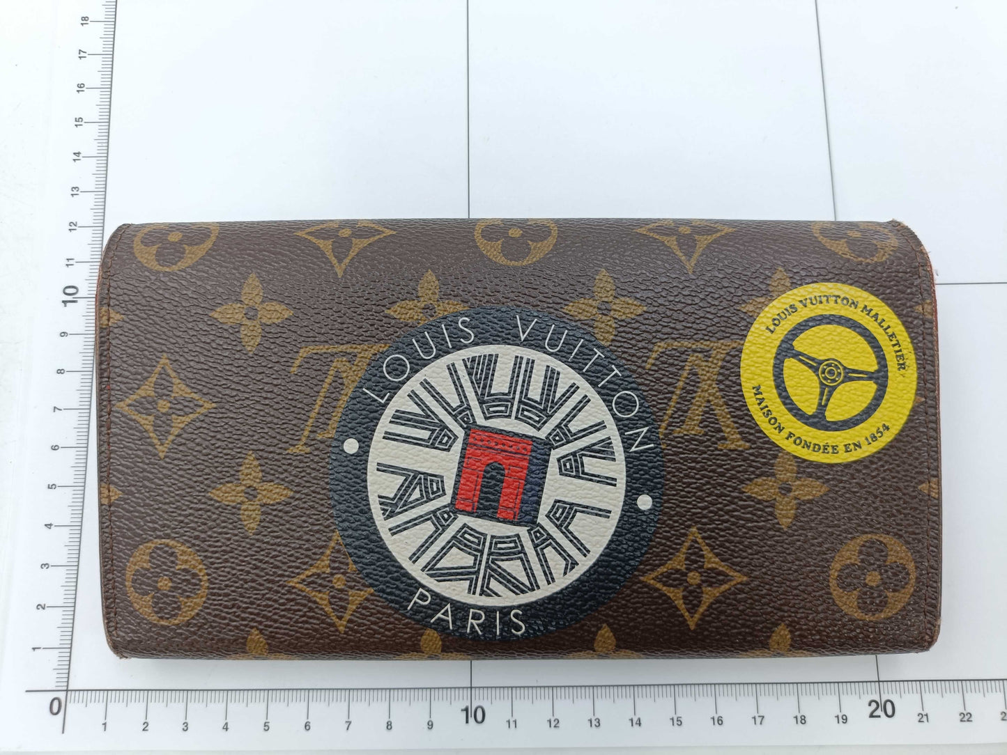 LOUIS VUITTON Monogram World Tour Portefeuille Sarah Wallet with Initials