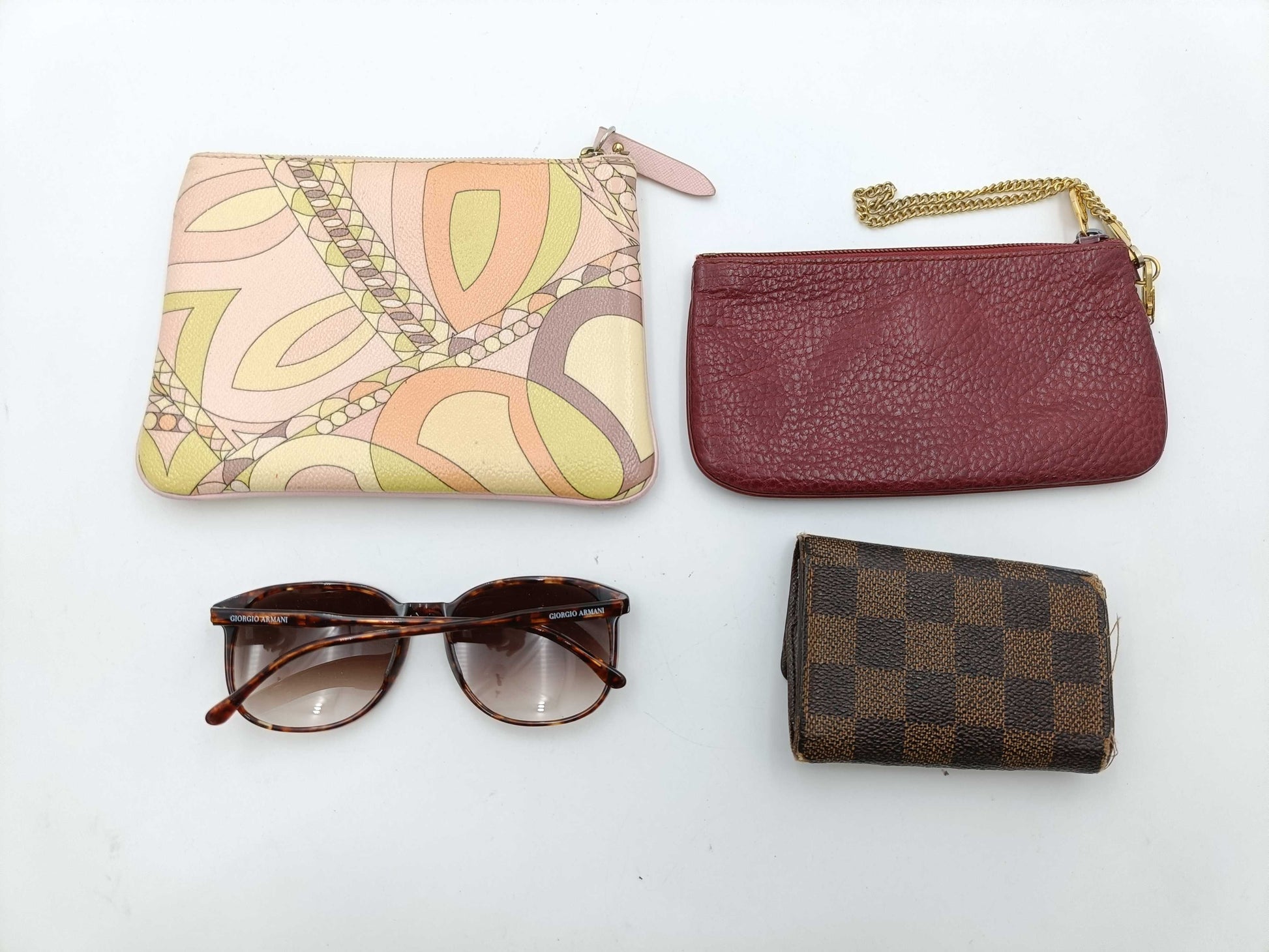 4 items including Armani, Louis Vuitton, Cartier, and Pucci sunglasses.