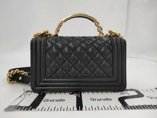 CHANEL Matelasse Top Handle Boy Caviar Black Handbag with Gold Hardware and Serial Number Plate