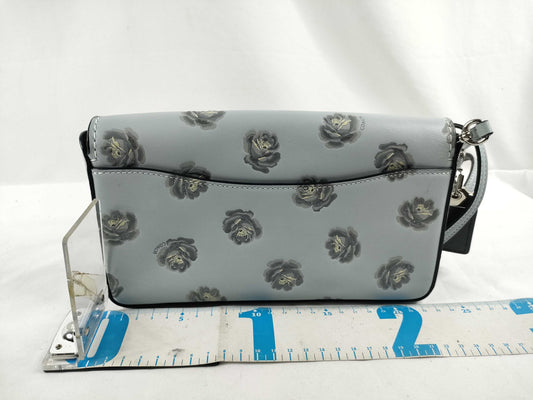 COACH shoulder bag in light blue calf leather with floral print