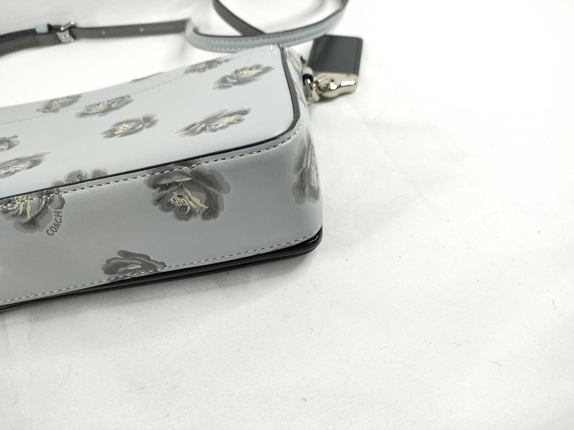 COACH shoulder bag in light blue calf leather with floral print