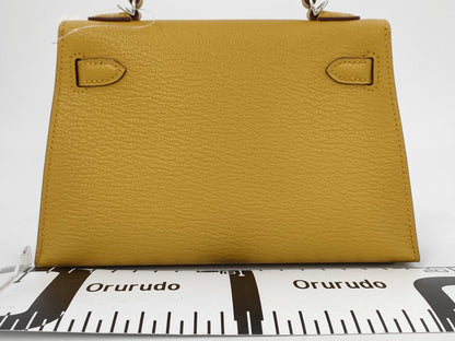 HERMES Mini Kelly Do Handbag, Chevre Jaune Ambre, Stitched, Silver Hardware, W Stamp, Hardware Seal