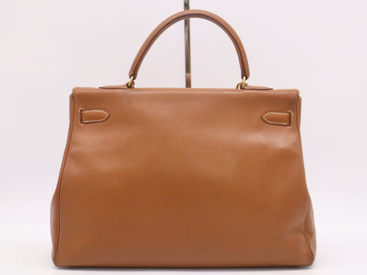 HERMES Kelly 32 Handbag with GD hardware, dust bag, padlock, clasp, and two keys.