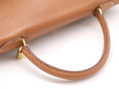 HERMES Kelly 32 Handbag with GD hardware, dust bag, padlock, clasp, and two keys.