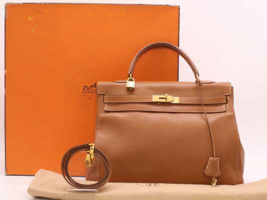 HERMES Kelly 32 Handbag with GD hardware, dust bag, padlock, clasp, and two keys.