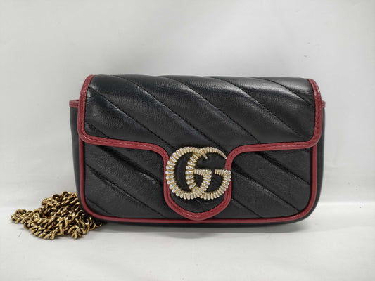 GUCCI Super Mini GG Marmont Matelasse Leather Shoulder Bag in Black, Red, and Gold Hardware with Chain Shoulder Strap 