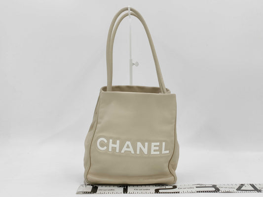 CHANEL Camellia Lambskin Tote Bag in White with CHANEL Logo Sticker