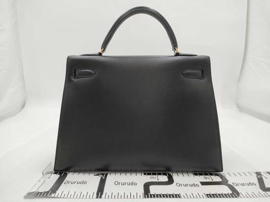 HERMES Kelly 32 Box Calf Leather Black with Storage Bag, Cadena Cloche, and Key, Small Handbag