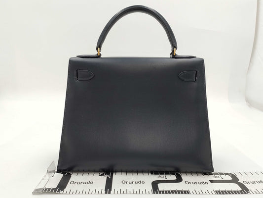 HERMES Kelly 28 Box Calfskin Navy with ST Cadena Crochet, Medium Handbag