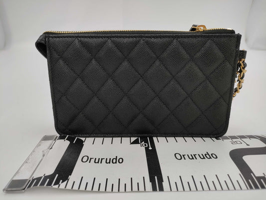 CHANEL CHANEL Multi-Pocket Clutch Bag in Black Caviar Skin with Seal