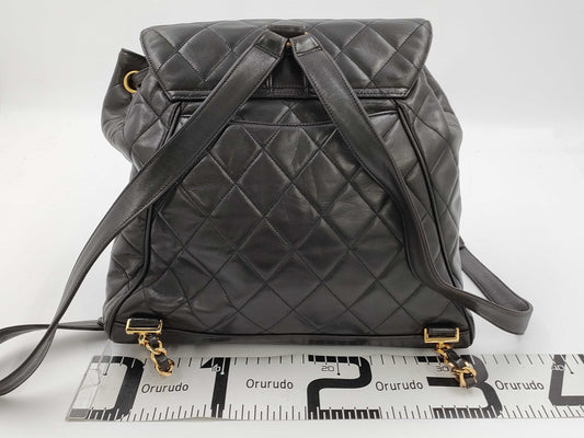 CHANEL Matelasse Lamb Black Backpack with Coco Mark