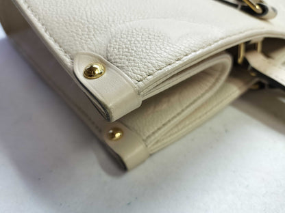 LOUIS VUITTON Monogram Empreinte Louis Vuitton On the Go MM Tote Bag