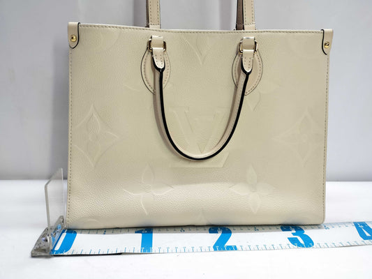 LOUIS VUITTON Monogram Empreinte Louis Vuitton On the Go MM Tote Bag