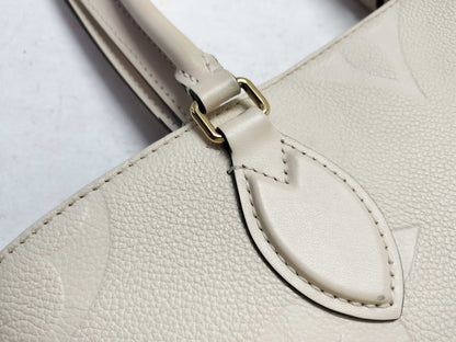 LOUIS VUITTON Monogram Empreinte Louis Vuitton On the Go MM Tote Bag