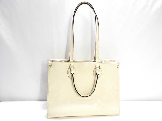 LOUIS VUITTON Monogram Empreinte Louis Vuitton On the Go MM Tote Bag