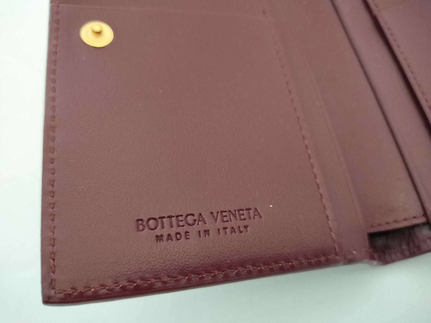 BOTTEGA VENETA 749940VCPP22247 Bi-fold Wallet, Barolo Bordeaux Leather, Gold, 2025 Current Model