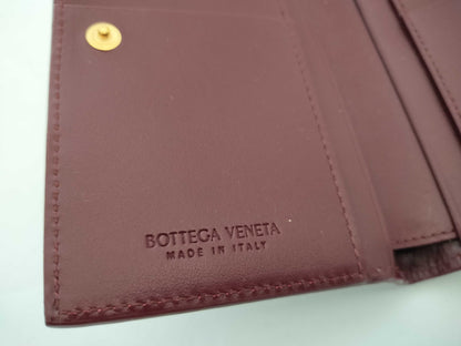 BOTTEGA VENETA 749940VCPP22247 Bi-fold Wallet, Barolo Bordeaux Leather, Gold, 2025 Current Model