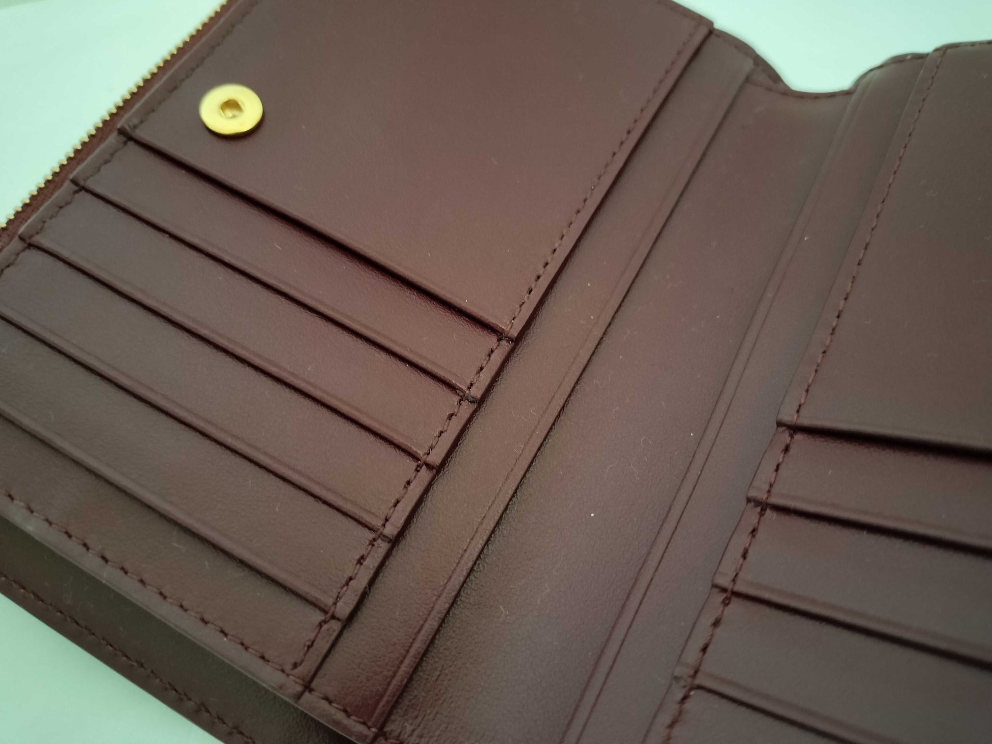 BOTTEGA VENETA 749940VCPP22247 Bi-fold Wallet, Barolo Bordeaux Leather, Gold, 2025 Current Model