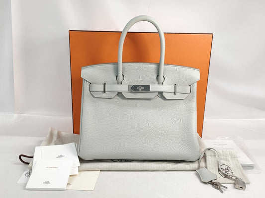 HERMES Birkin 30 handbag in ivory with silver hardware and a C stamp.