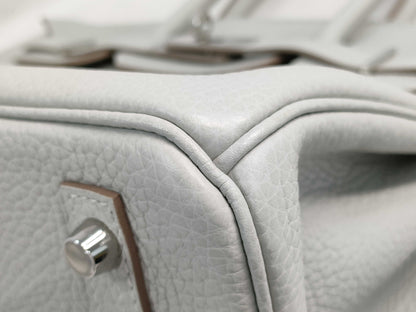 HERMES Birkin 30 handbag in ivory with silver hardware and a C stamp.