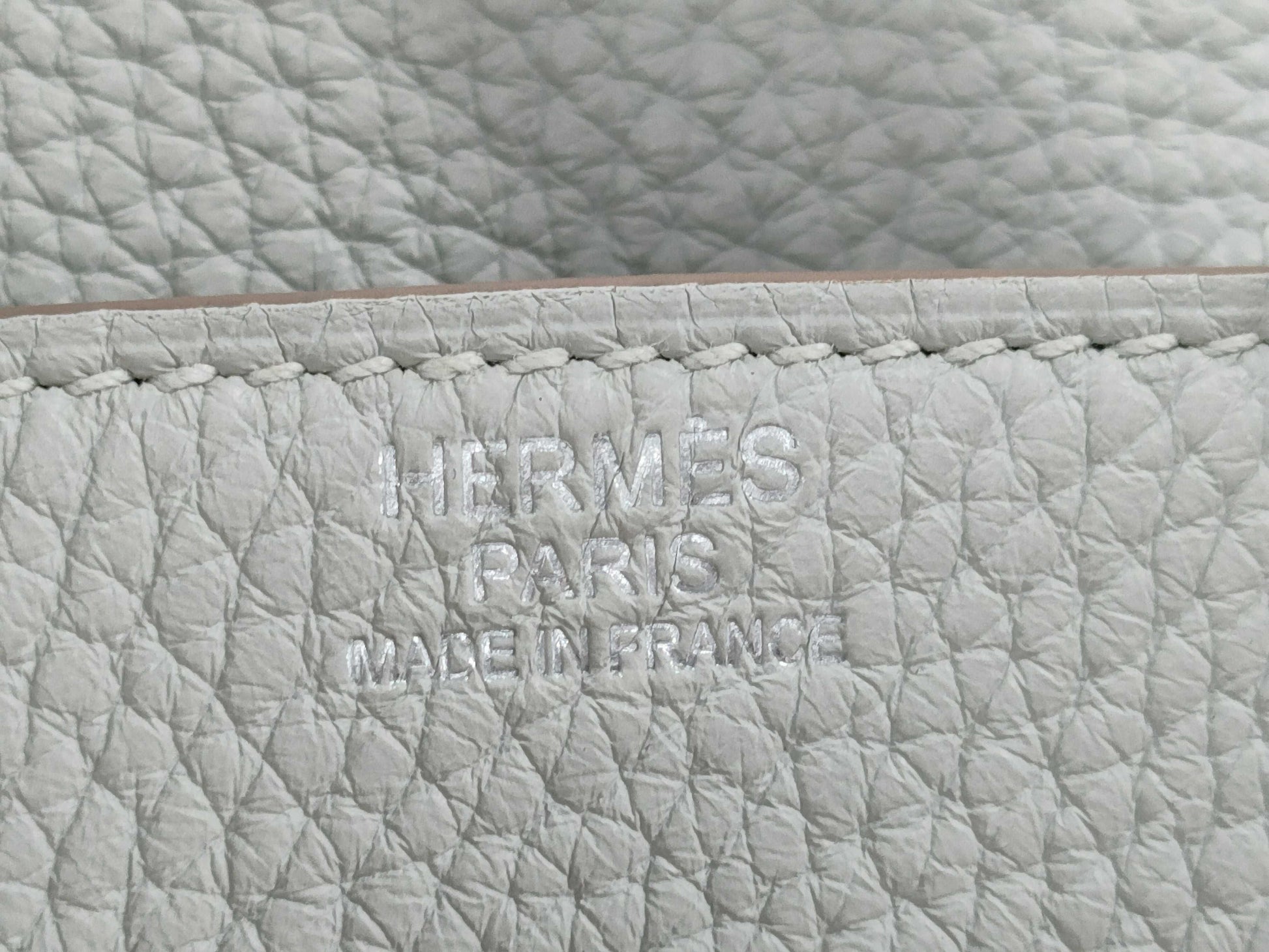 HERMES Birkin 30 handbag in ivory with silver hardware and a C stamp.