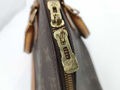 LOUIS VUITTON Monogram Alma Handbag