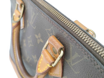 LOUIS VUITTON Monogram Alma Handbag