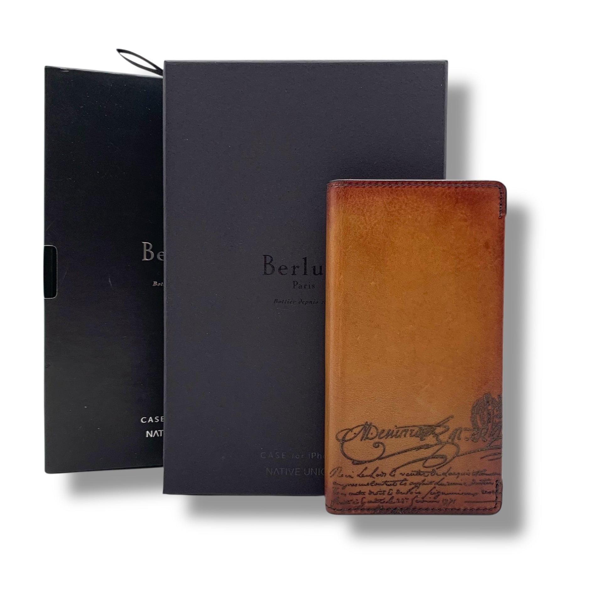Berluti smartphone case with box and other accessories