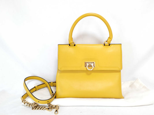 Salvatore Ferragamo Gancini ID - Salvatore Ferragamo Leather Trifolio Top Handle Yellow Handbag 25cm GHW