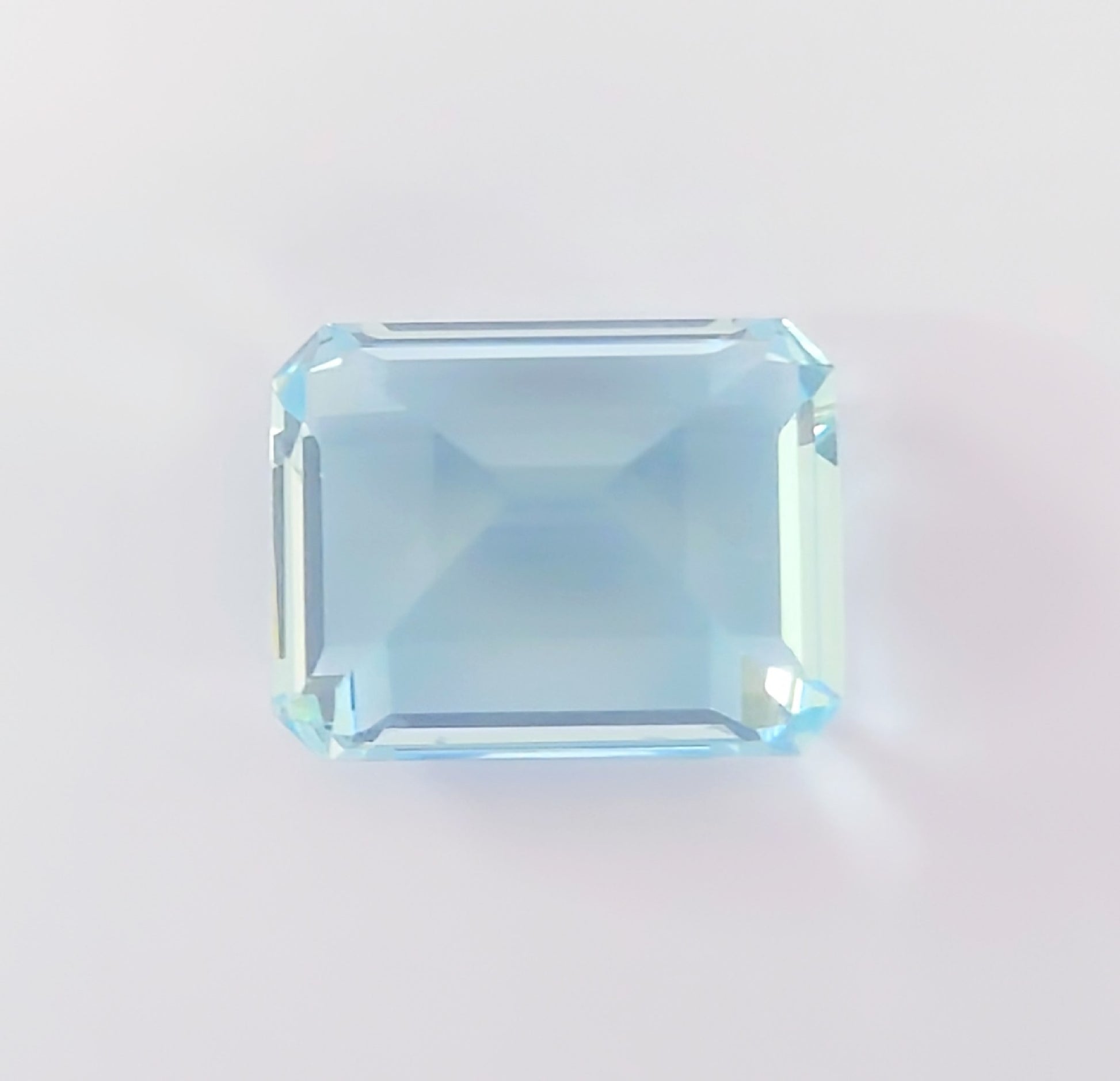 AQ 12.322ct, approx. 15.77 x 12.24 x 10.07mm, loose colored stone.