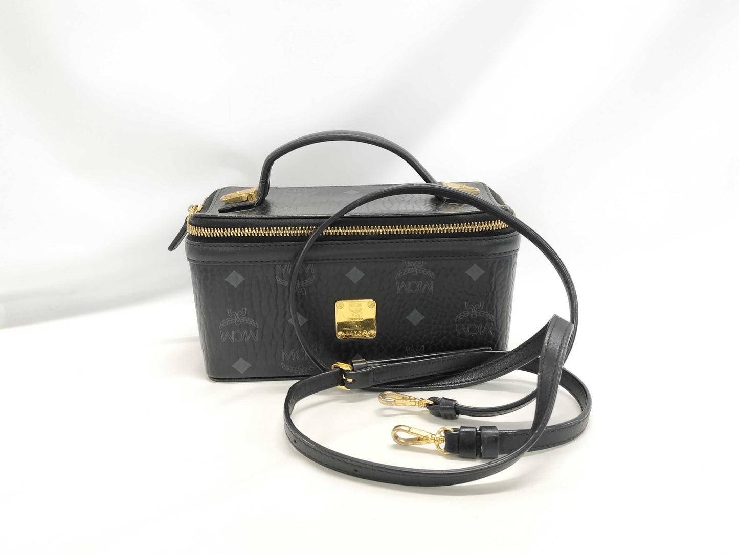 MCM Visetos Vanity Case, 2-Way Handbag, Black with Gold Hardware, PVC Leather, and Leather.