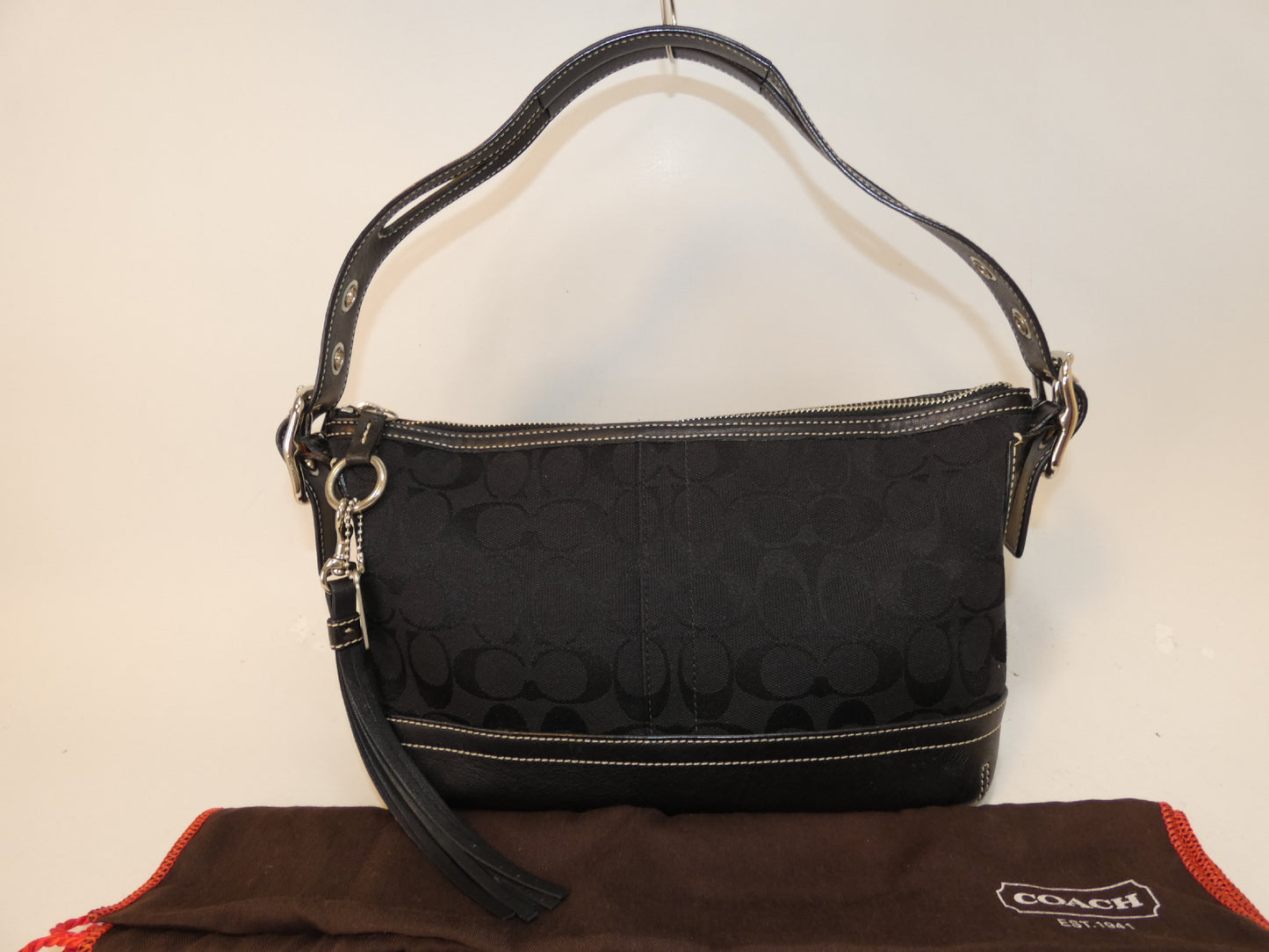 COACH Signature Canvas and Leather Black Tassel Pull One-Hand Handbag
