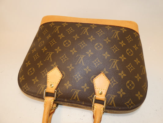 LOUIS VUITTON Alma Monogram Handbag