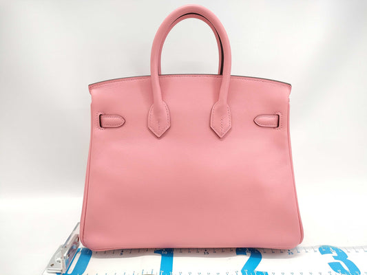 HERMES Birkin 25 in Swift leather with Rose Azalee finish and sterling silver hardware, featuring a "Y" stamp.