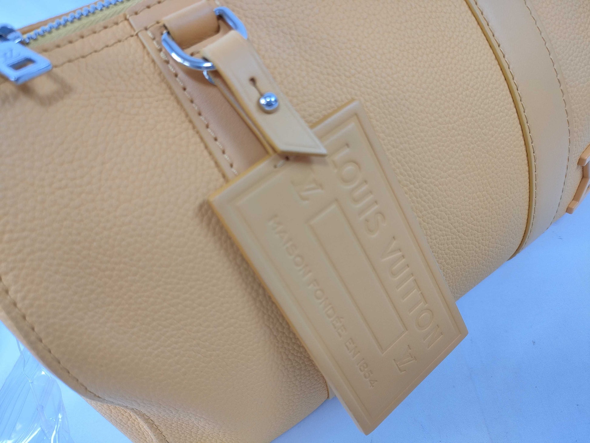 LOUIS VUITTON RFID Verified, Serial Number Unverifiable, Epi Louis Vuitton City Keepall Handbag