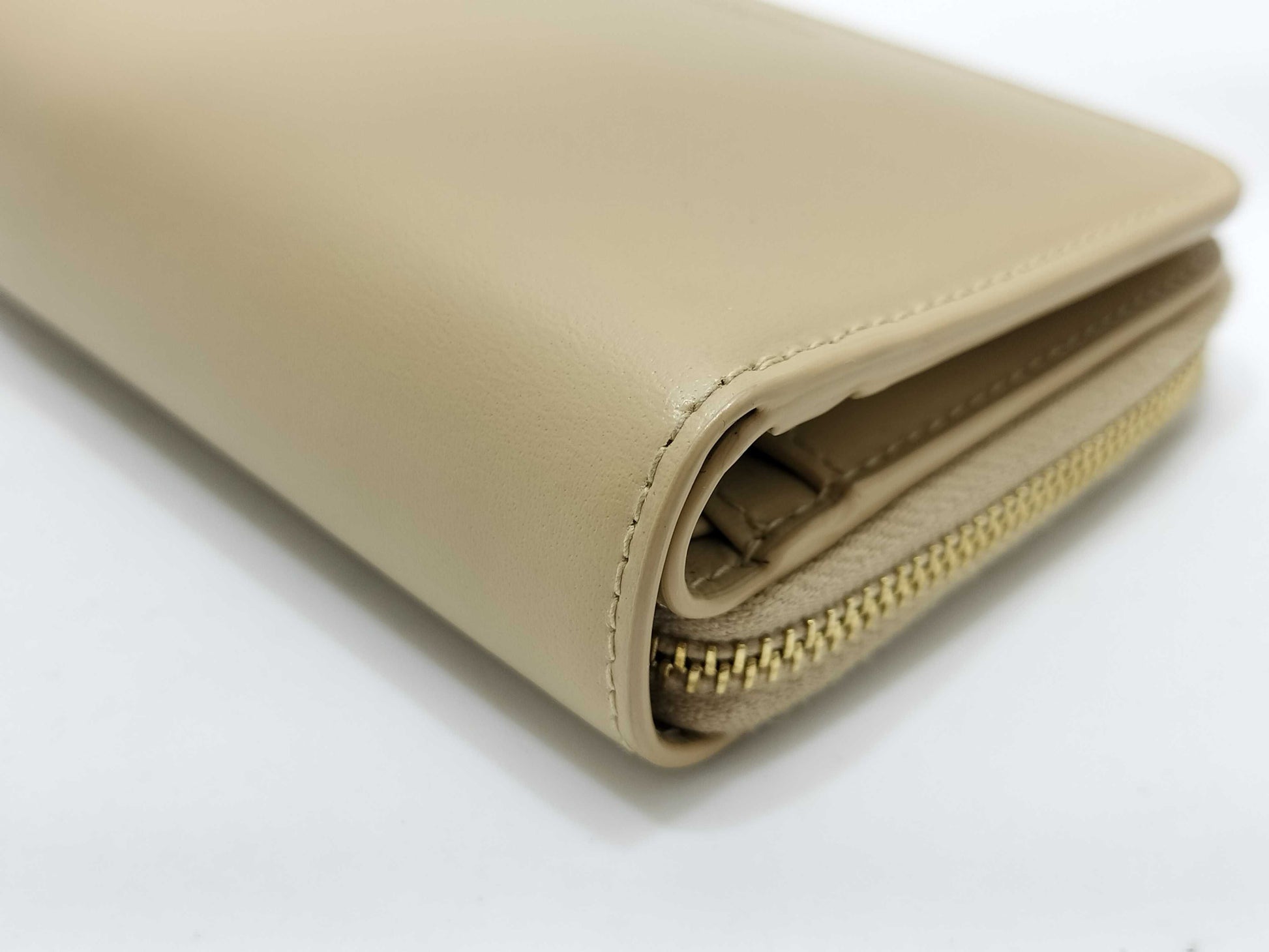 Yves Saint Laurent Paris Logo Bifold Wallet in Beige Leather