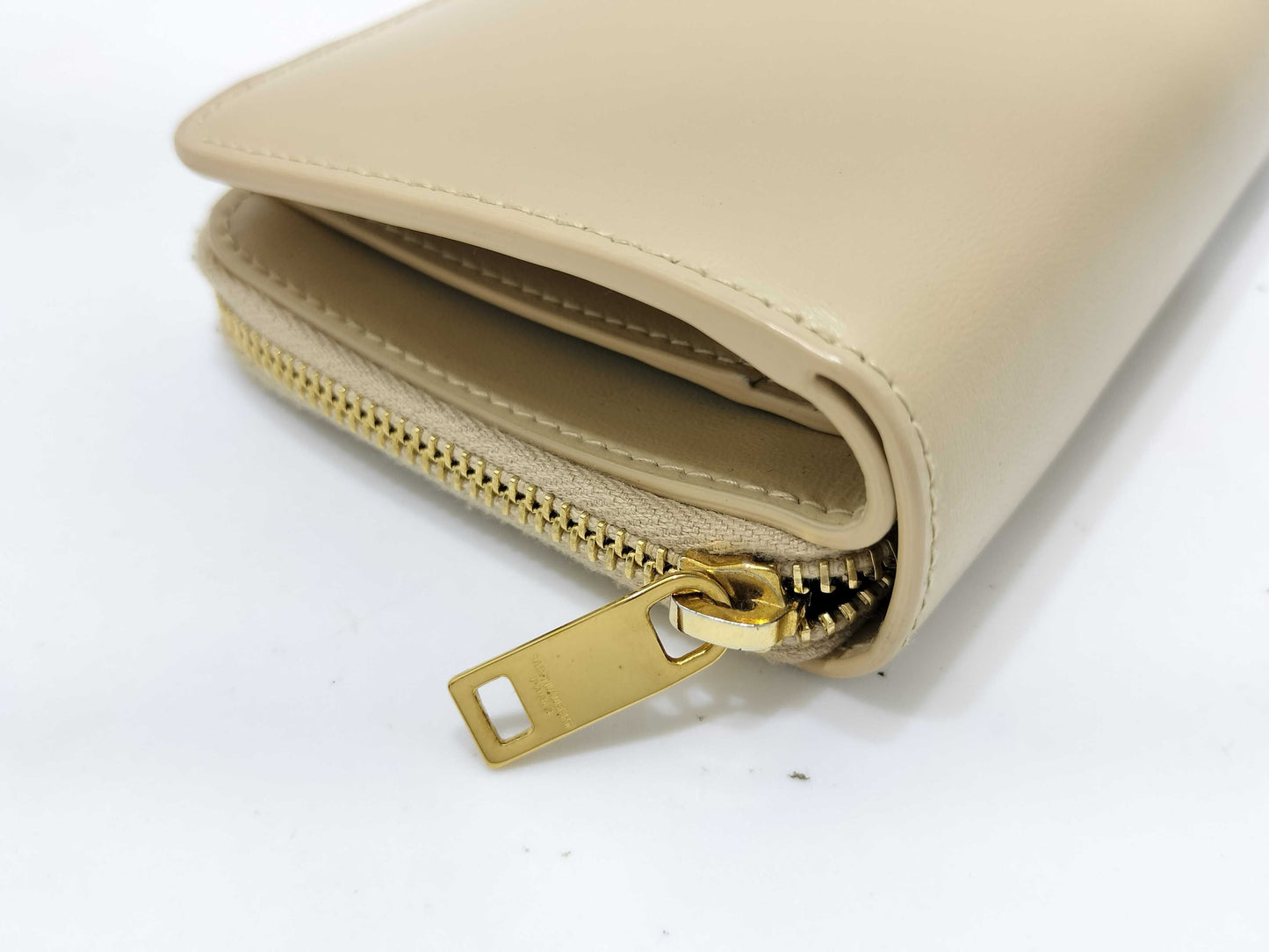 Yves Saint Laurent Paris Logo Bifold Wallet in Beige Leather