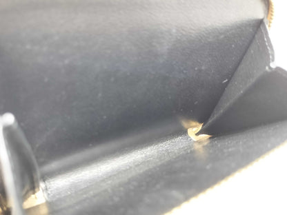 Yves Saint Laurent Paris Logo Bifold Wallet in Beige Leather