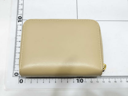 Yves Saint Laurent Paris Logo Bifold Wallet in Beige Leather