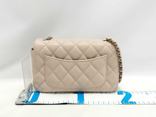 CHANEL Mini Matelasse 18 Shoulder Bag, Beige Lambskin with Champagne Gold Hardware, P64HJ013